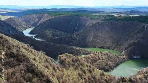 Aerial view of meanders at rocky river Uvac gorge on sunny day, southwest Serbia