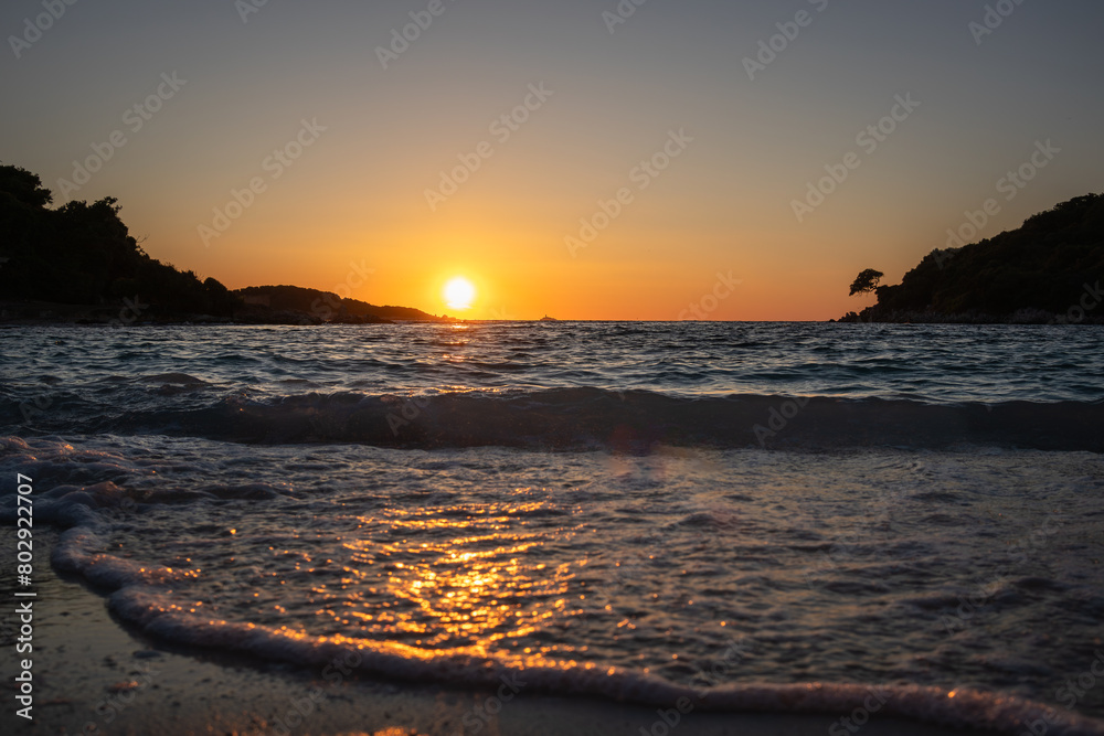 Low Angle View of Ionian Sea Wave during Golden Hour in South Albania. Wavy Water with Sunset in Ksamil.