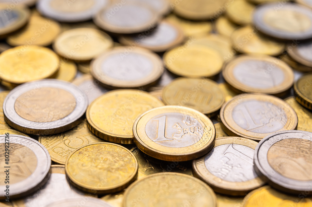 Euro coins close to each other, and 1 euro coin. Euro coins close to each other, and 1 euro coin.