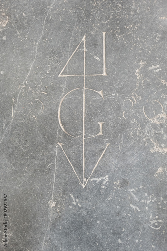 Symbol engraving on a floor slab of the Hooglandse Kerk in Leiden