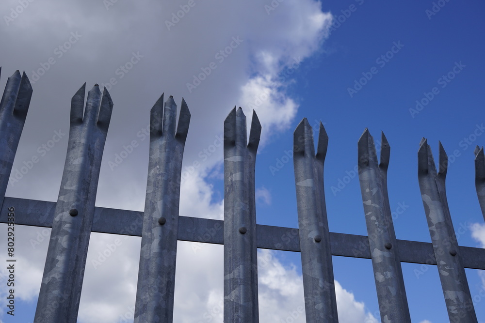 metal security fence. boundary fencing background 