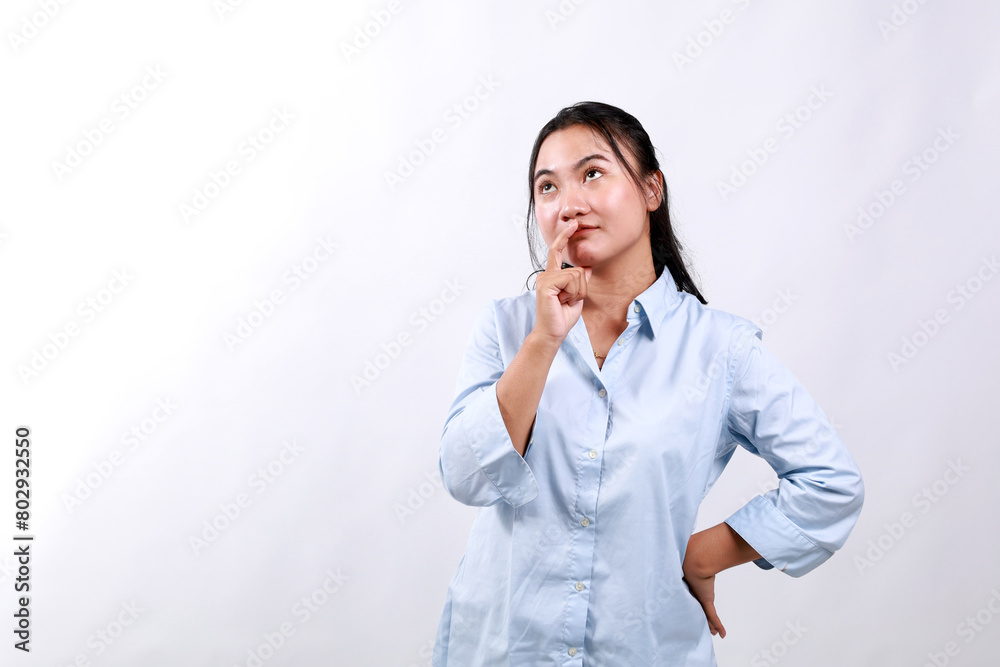 Young minded happy woman of Asian ethnicity 20s wear office clothes look above on workspace area mock up prop up chin isolated on white background studio People lifestyle concept Young minded happy woman of Asian ethnicity 20s wear office clothes look above on workspace area mock up prop up chin isolated on white background studio People lifestyle concept