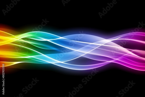 A vibrant, colorful wave of light dances gracefully against a dark, black background, creating a mesmerizing visual spectacle.