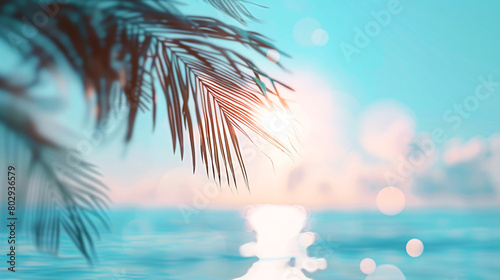 serene view of a sparkling sea through the silhouette of palm leaves  with sunlight filtering through and creating a shimmering effect on the water s surface