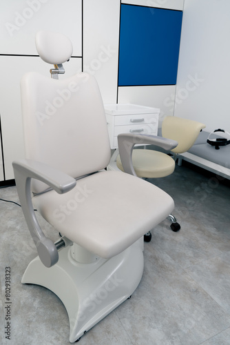 close up in the clinic in a bright modern office there is a chair for examining patient