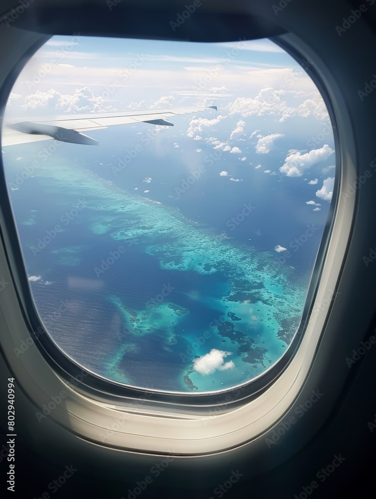 Beautiful view of sea through the aircraft window. Airplane window. Concept of travel and air transportation Beautiful view of sea through the aircraft window. Airplane window. Concept of travel and air transportation