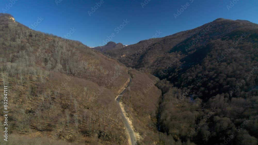 Beautiful aerial view of a mountain road in a picturesque gorge. Landscape and nature of the North Caucasus Beautiful aerial view of a mountain road in a picturesque gorge. Landscape and nature of the North Caucasus