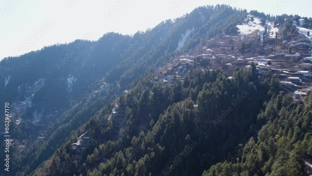 snow-capped hill station surrounded by a dense forest in Ayubia National Park, Nathya Gali, Pakistan snow-capped hill station surrounded by a dense forest in Ayubia National Park, Nathya Gali, Pakistan