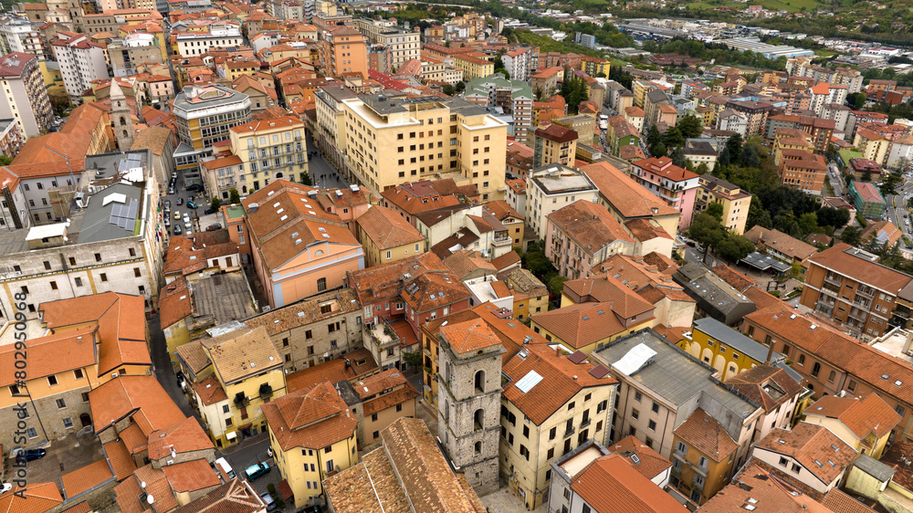 Aerial view of the historic center of the city of Potenza, in Basilicata, Italy. The houses in the old town have traditional red sloping roofs.