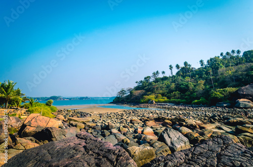 Hiking on the rocks at Palolem Beach, South Goa photo