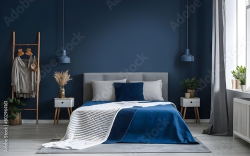 Empty-painted deep blue wall. Blue color bedding furniture and blank background.Bedroom interior trend 2024 year Modern luxury apricot room interior home designs.