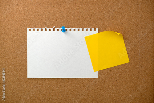 Blank sticky note paper on cork board wall. Noticeboard to organize life and work concept