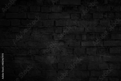 Old black brick wall tetxure. Dark wallpaper