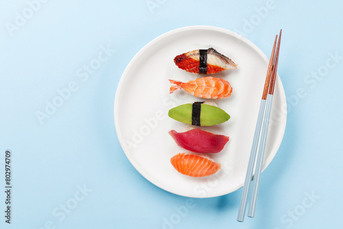 Various sushi plate on blue table