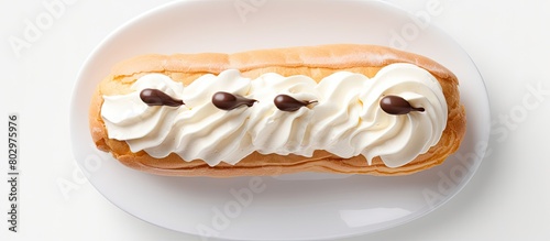 A cream filled eclair is se...