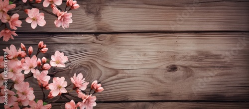 A copy space image of floral patterns adorning a wooden background
