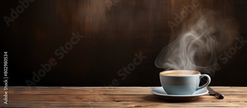 A copy space image featuring a steaming cup of coffee resting on a rustic wooden table