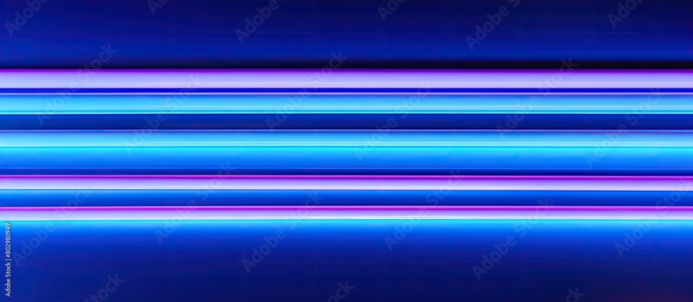 A copy space image featuring narrow paper stripes on a vibrant neon blue background seen in a close up view A copy space image featuring narrow paper stripes on a vibrant neon blue background seen in a close up view
