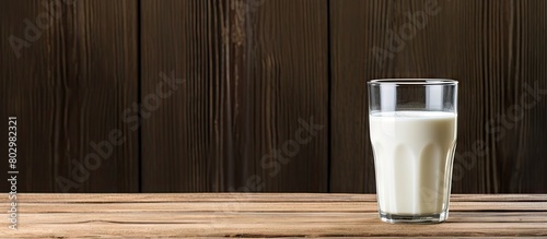 A copy space image of milk placed on a rustic wooden table