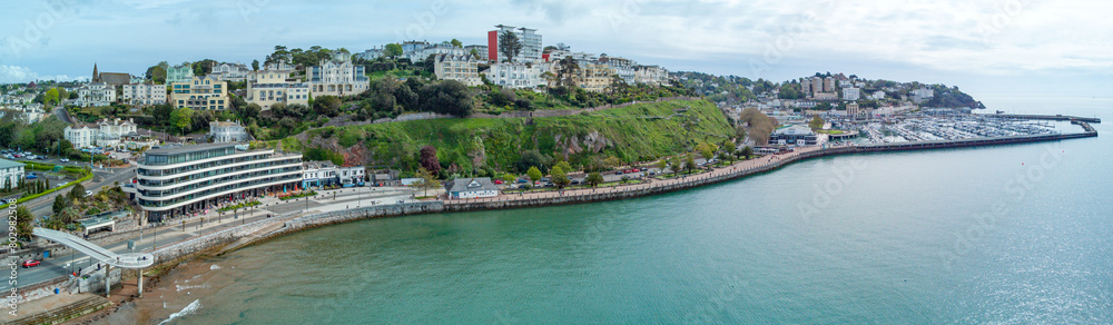 Torquay seafront aerial panorama image. English riviera with cafe's, bars.Torquay marina in the background with boats and yachts . Princess theatre.