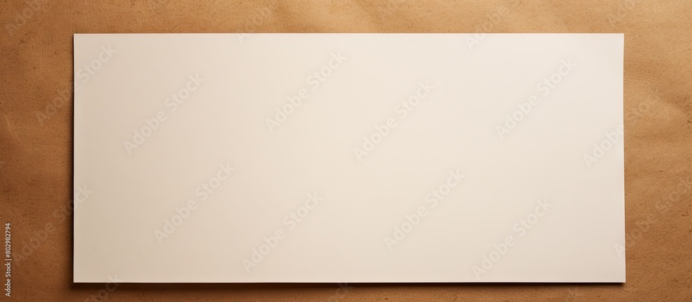 A copy space image of a white blank contrasted against a brown paper