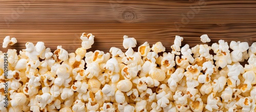 A delicious popcorn is elegantly arranged on a white wooden table with enough room for text in the image. with copy space image. Place for adding text or design