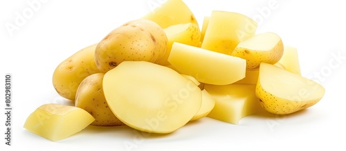 A copy space image of raw peeled potatoes can be seen isolated on a white background photo