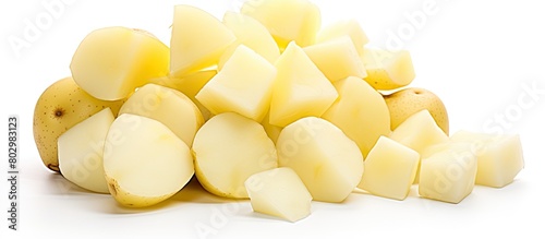 A copy space image of raw peeled potatoes can be seen isolated on a white background photo