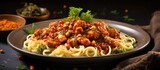 A delectable dish of pasta with a rich sauce made from smoked paprika powder tender meat succulent chicken flavorful gambas and hearty chickpeas. with copy space image
