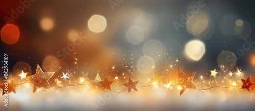 A festive Christmas themed image featuring twinkling stars on an abstract background perfect for use as a copy space image