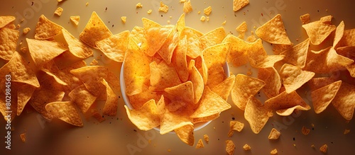 A copy space image showing a bird s eye view of nacho chips being dipped photo