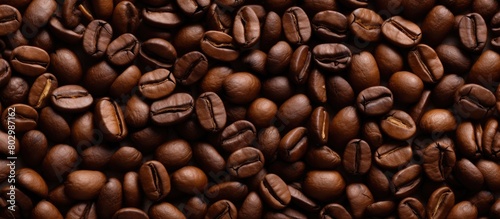 A bird s eye view of coffee beans as a background creating an enticing copy space image