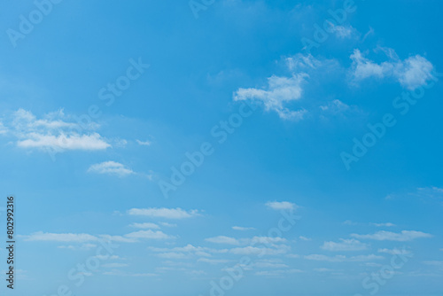 abstract background of white fluffy clouds on a bright blue sky © Mariia