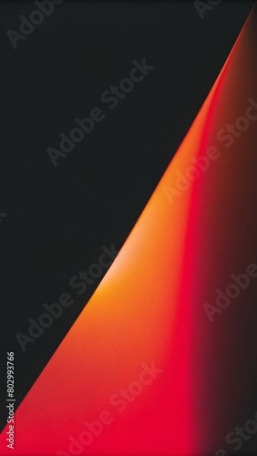 A dark gradient background with red and pink gradients on the right, going from black to white in the middle of an abstract shape.