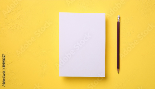 Mock-up of white blank card sheet of paper on yellow textured surface. Postcard template.