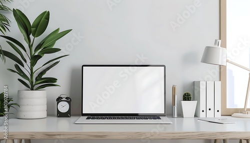 modern office scene with a minimalist laptop on a bright white screen
