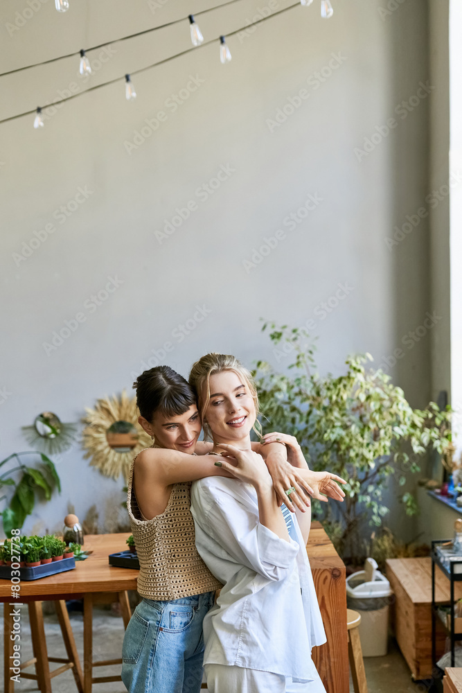 Naklejka premium Two women in the room, sharing a warm and loving embrace.