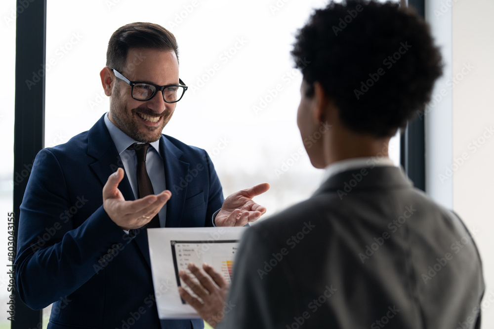 Business woman and businessman talking about new project Business woman and businessman talking about new project
