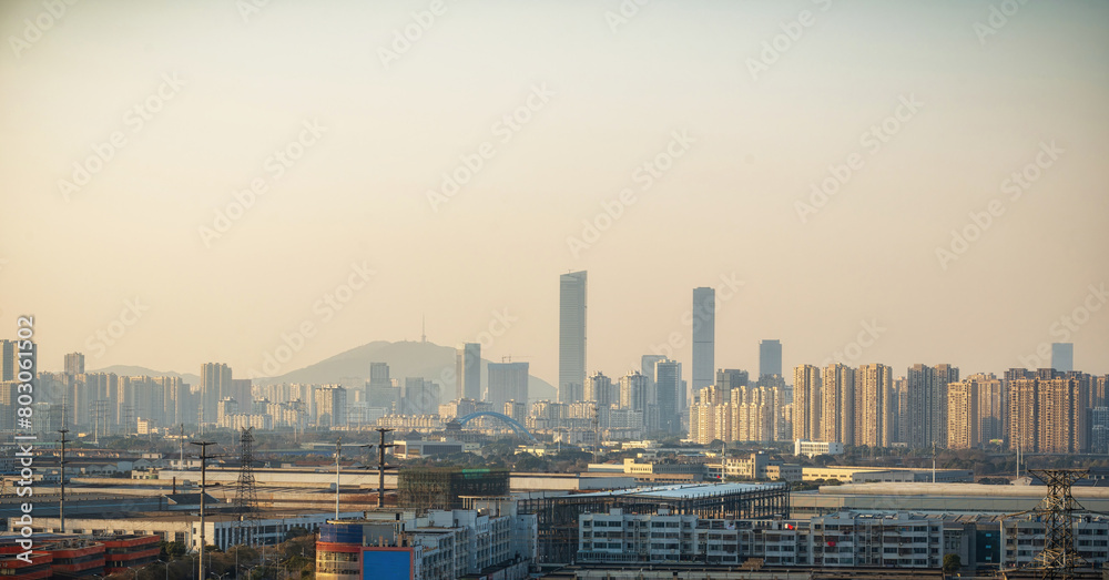 Cityscape of Wuxi with a River in the Foreground