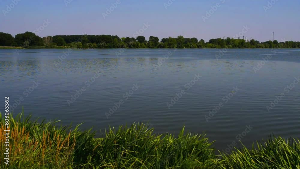 The large lake on a clear summer day. The large lake on a clear summer day.