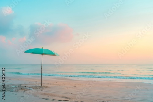 Serene Beach at Sunrise with Pastel Sky and Beach Umbrella  Tranquil Morning Seascape  Copy Space