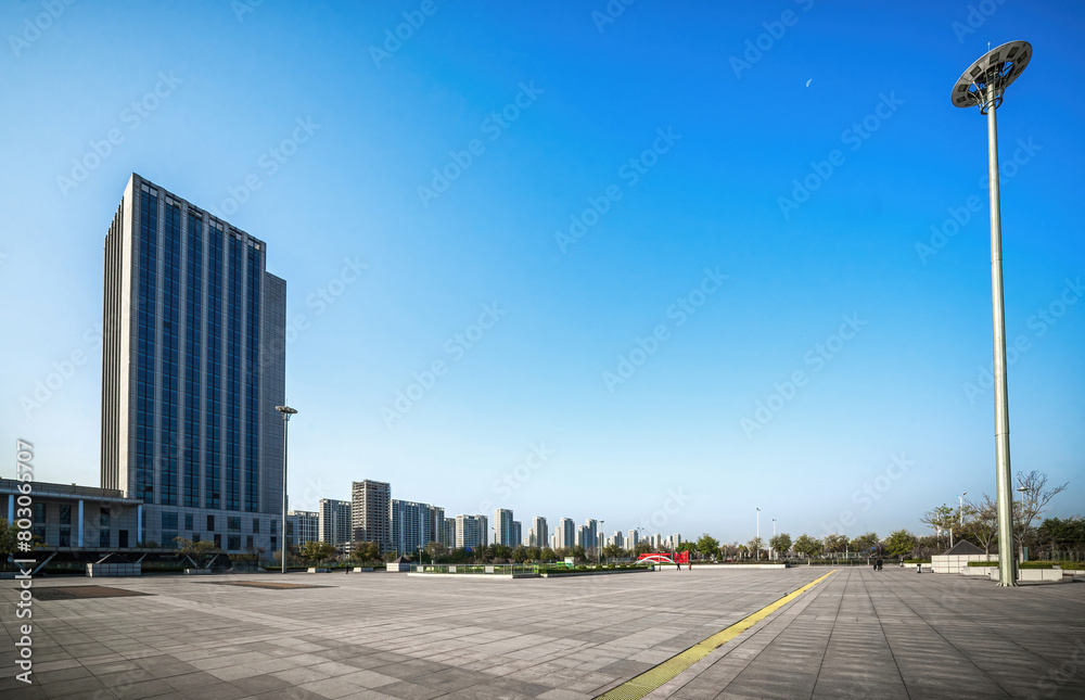 Wide Open Urban Space with Modern Buildings Against Blue Sky Wide Open Urban Space with Modern Buildings Against Blue Sky