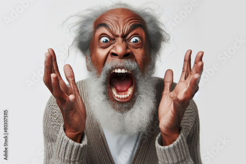 angry old black man with open mouth waving his hands on a white background photo