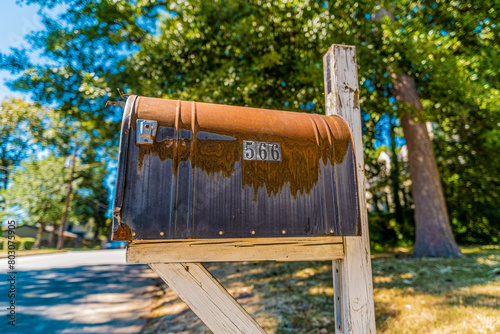 Old and rusty mailbox in the suburbs of the United States