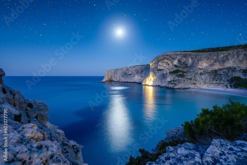 Serene Night Seascape with Full Moon, Starry Sky, Calm Ocean, Moon Reflection, Majestic Cliffs © Bernardo