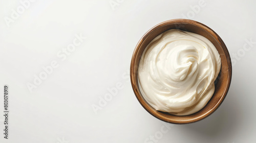 Bowl with tasty sour cream on white background