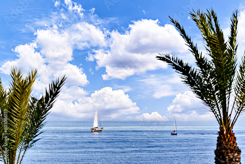 Spectacular image with calm sea and sailboat in the background on Aguadulce beach, Almeria, Spain photo