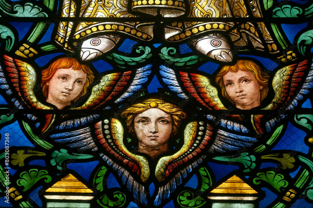 A stained-glass window depicting angels. Vitrail représentant des anges. Aix-les-Bains - France.