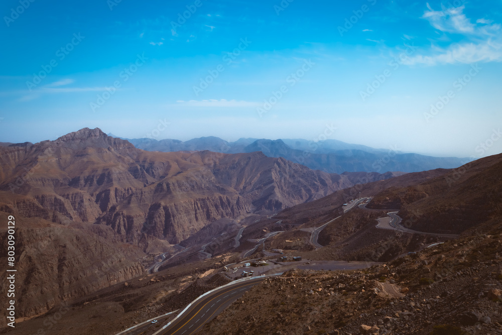 Jebel jais mountain, Majestic Rocky Mountains Under Clear Blue Sky During a Sunny Day Jebel jais mountain, Majestic Rocky Mountains Under Clear Blue Sky During a Sunny Day