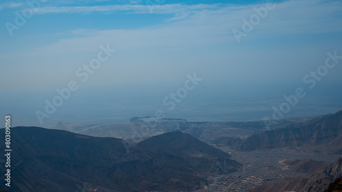 Jebel jais mountain, Majestic Rocky Mountains Under Clear Blue Sky During a Sunny Day © tashmetova808